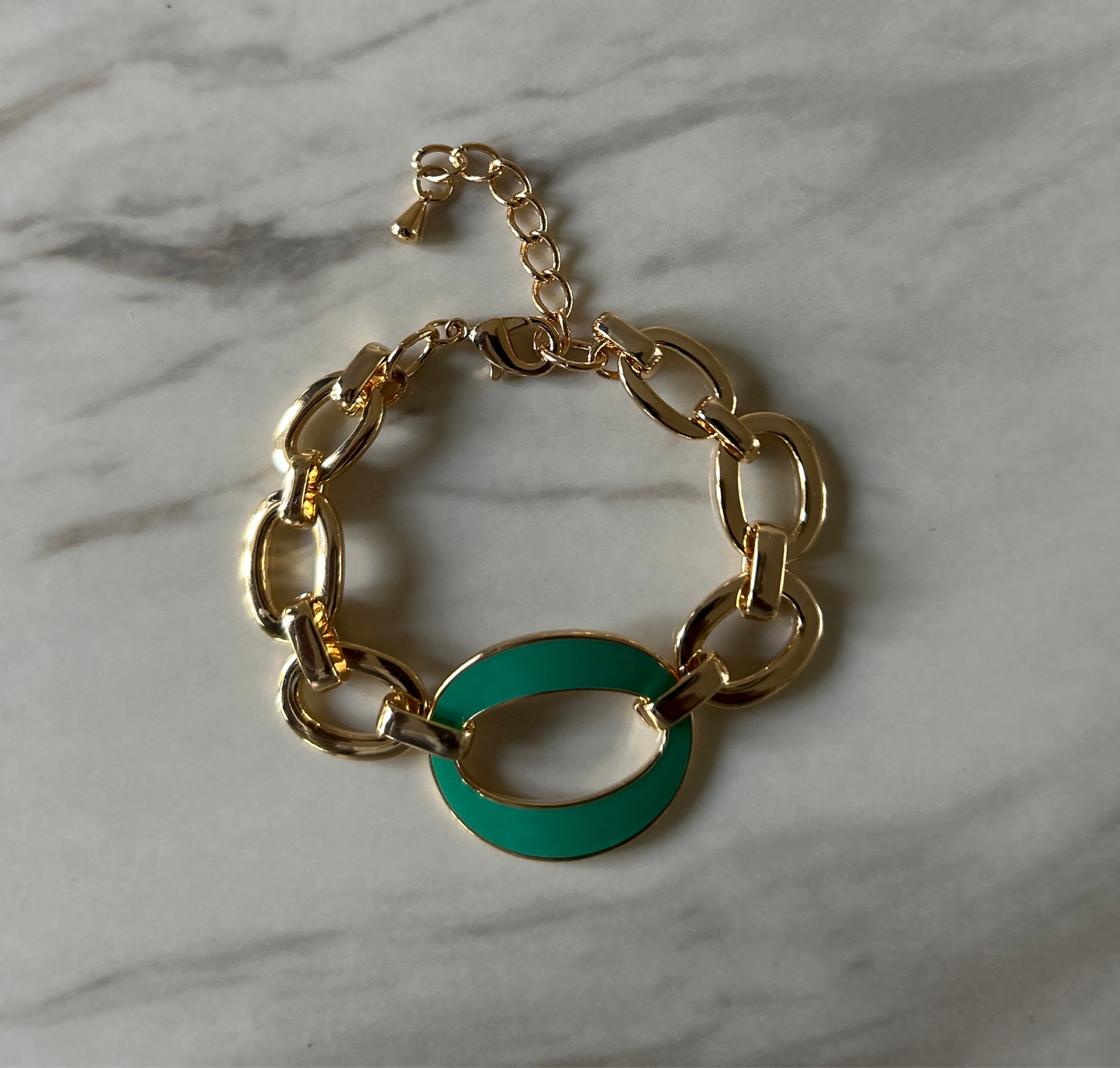 Gold plated bracelet with green design